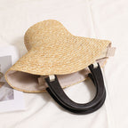 Brim Sculptural Straw Handbag — close-up of sculptural straw weave