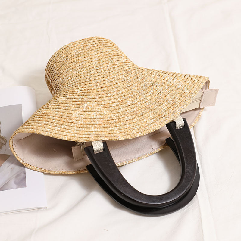 Brim Sculptural Straw Handbag — close-up of sculptural straw weave