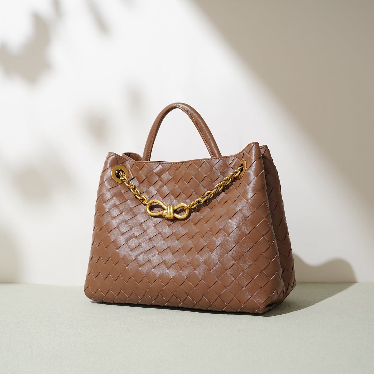 Woven cowhide braided chain tote bag — side view